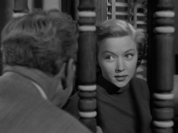 Movie still from “In a Lonely Place” (1950), directed by Nicholas Ray – A man and a woman looking at one another in a room; Close Up shot, Over the shoulder angle