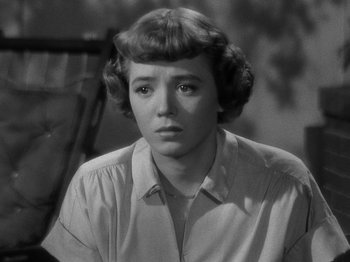 Movie still from “In a Lonely Place” (1950), directed by Nicholas Ray – A black - and - white photo of a young woman; Close Up shot, High angle