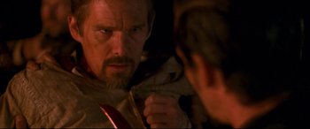 Movie still from “In a Valley of Violence” (2016), directed by Ti West – A person holding a knife; Close Up shot, Over the shoulder angle