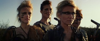 A group of women standing next to each other