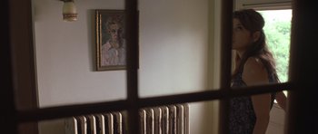 Movie still from “In the Bedroom” (2001), directed by Todd Field – A painting of a man hanging on the wall behind a radiator; Close Up shot, Low angle