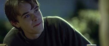 Movie still from “In the Bedroom” (2001), directed by Todd Field – A young man's face in the dark; Close Up shot, Over the shoulder angle
