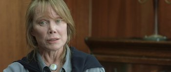 Movie still from “In the Bedroom” (2001), directed by Todd Field – A person wearing a necklace; Close Up shot, Over the shoulder angle