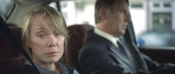 Movie still from “In the Bedroom” (2001), directed by Todd Field – A woman and a man sitting in a car; Close Up shot, Over the shoulder angle