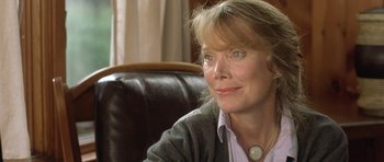 Movie still from “In the Bedroom” (2001), directed by Todd Field – A person sitting in a chair; Close Up shot, Over the shoulder angle