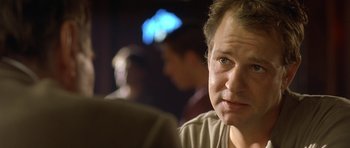 Movie still from “In the Bedroom” (2001), directed by Todd Field – A person sitting in front of another person; Close Up shot, Over the shoulder angle