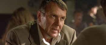 Movie still from “In the Bedroom” (2001), directed by Todd Field – A person wearing a suit; Close Up shot, Low angle