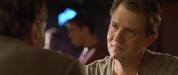 Movie still from “In the Bedroom” (2001), directed by Todd Field – A woman sitting in front of another man; Close Up shot, Over the shoulder angle