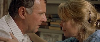 Movie still from “In the Bedroom” (2001), directed by Todd Field – A man and a woman looking at each other's faces; Close Up shot, Over the shoulder angle