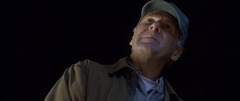 Movie still from “In the Bedroom” (2001), directed by Todd Field – A person wearing a hat and a jacket; Close Up shot, Low angle