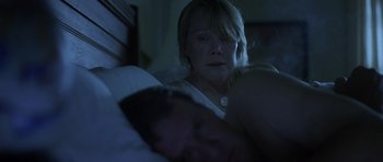 Movie still from “In the Bedroom” (2001), directed by Todd Field – A woman is looking at a man in a bed; Close Up shot, Over the shoulder angle