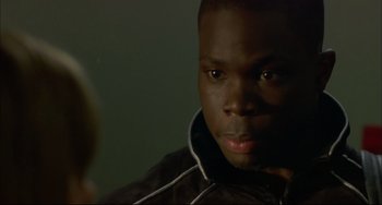 Movie still from “In the Cut” (2003), directed by Jane Campion – A person wearing a black jacket; Close Up shot, Over the shoulder angle