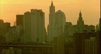 Movie still from “In the Cut” (2003), directed by Jane Campion – A view of a city skyline at sunset; Extreme Wide shot, Low angle