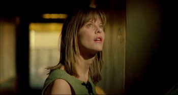 Movie still from “In the Cut” (2003), directed by Jane Campion – A woman looking up at the sky in a green dress; Close Up shot, Low angle