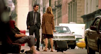 Movie still from “In the Cut” (2003), directed by Jane Campion – A man and a woman walking down a street; Wide shot, Low angle