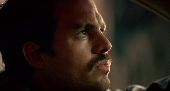 Movie still from “In the Cut” (2003), directed by Jane Campion – A man with a mustache looking up; Close Up shot, Low angle