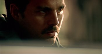 Movie still from “In the Cut” (2003), directed by Jane Campion – A man's face with a beard; Extreme Close Up shot, Low angle