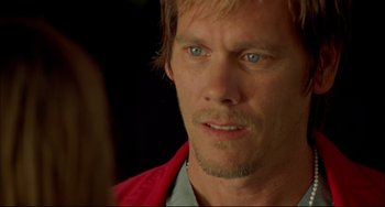 Movie still from “In the Cut” (2003), directed by Jane Campion – A person wearing a red jacket; Close Up shot, Over the shoulder angle