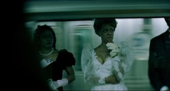 Movie still from “In the Cut” (2003), directed by Jane Campion – A woman in a white dress and a woman in a white dress; Medium shot, Low angle