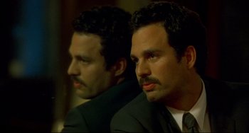 Movie still from “In the Cut” (2003), directed by Jane Campion – Two men in suits and ties are looking at the camera; Close Up shot, Over the shoulder angle