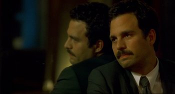 Movie still from “In the Cut” (2003), directed by Jane Campion – Two men in business suits sitting next to each other; Close Up shot, Over the shoulder angle