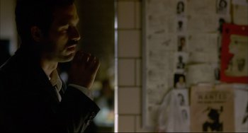 Movie still from “In the Cut” (2003), directed by Jane Campion – A person wearing a suit and tie; Close Up shot, Over the shoulder angle