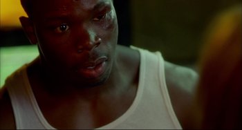 Movie still from “In the Cut” (2003), directed by Jane Campion – A person with a bruise on his face; Close Up shot, High angle