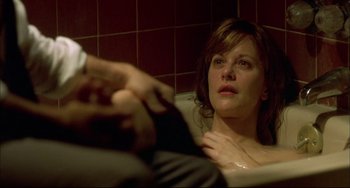 Movie still from “In the Cut” (2003), directed by Jane Campion – A woman sitting in a bath tub next to a man; Close Up shot, High angle