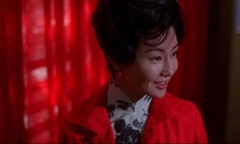 Movie still from “In the Mood for Love” (2000), directed by Kar-Wai Wong – A person wearing a red jacket; Close Up shot, Low angle