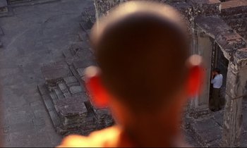 Movie still from “In the Mood for Love” (2000), directed by Kar-Wai Wong – A blurry image of a young child's face; Extreme Close Up shot, Low angle