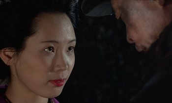 Movie still from “In the Realm of the Senses” (1976), directed by Nagisa Ôshima – A man and a woman looking at one another; Close Up shot, Over the shoulder angle