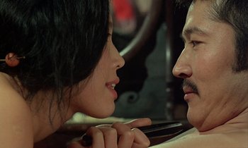 Movie still from “In the Realm of the Senses” (1976), directed by Nagisa Ôshima – A man and a woman looking at one another; Close Up shot, Over the shoulder angle