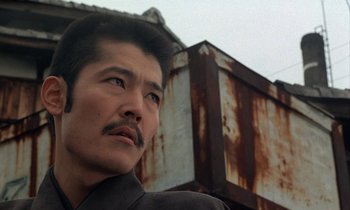 Movie still from “In the Realm of the Senses” (1976), directed by Nagisa Ôshima – A person looking up at the sky; Close Up shot, Low angle