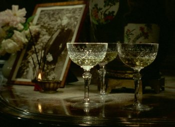Movie still from “India Song” (1975), directed by Marguerite Duras – A couple of wine glasses sitting on top of a table; Extreme Close Up shot, High angle