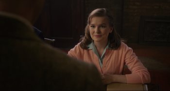 Movie still from “Indignation” (2016), directed by James Schamus – A woman sitting in front of a man in front of a table; Medium shot, Over the shoulder angle
