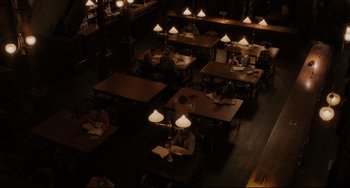Movie still from “Indignation” (2016), directed by James Schamus – A group of people sitting at tables in a library; Extreme Wide shot, High angle