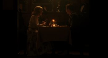 Movie still from “Indignation” (2016), directed by James Schamus – A man and a woman sitting at a dinner table; Wide shot, High angle
