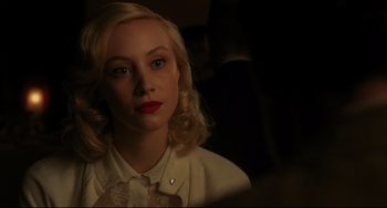 Movie still from “Indignation” (2016), directed by James Schamus – A woman with blonde hair and blue eyes wearing a white shirt; Close Up shot, Over the shoulder angle