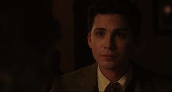 Movie still from “Indignation” (2016), directed by James Schamus – A man in a suit and tie looking at the camera; Close Up shot, Over the shoulder angle