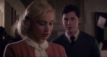 Movie still from “Indignation” (2016), directed by James Schamus – A young woman and a young man standing next to each other; Close Up shot, Over the shoulder angle