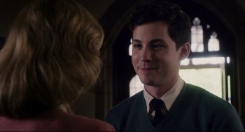 Movie still from “Indignation” (2016), directed by James Schamus – A man in a suit and tie looking at a woman in front of a mirror; Close Up shot, Over the shoulder angle