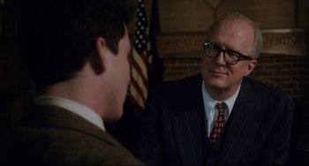 Movie still from “Indignation” (2016), directed by James Schamus – A man in a suit talking to another man in a suit; Close Up shot, Over the shoulder angle
