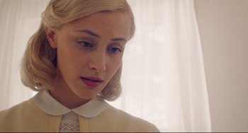 Movie still from “Indignation” (2016), directed by James Schamus – A young woman with blonde hair wearing a white shirt; Close Up shot, Over the shoulder angle