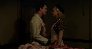 Movie still from “Indignation” (2016), directed by James Schamus – A man and a woman are standing next to each other; Medium shot, High angle