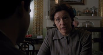 Movie still from “Indignation” (2016), directed by James Schamus – An older woman sitting at a dining room table; Close Up shot, Over the shoulder angle