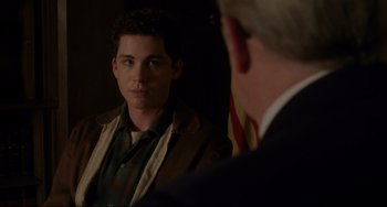 Movie still from “Indignation” (2016), directed by James Schamus – A young man looking at himself in a mirror; Medium shot, Over the shoulder angle