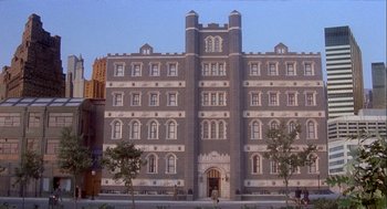 Movie still from “Inferno” (1980), directed by Dario Argento – A large building that has many windows on it's side; Extreme Wide shot, High angle
