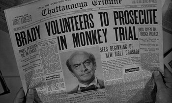 Movie still from “Inherit the Wind” (1960), directed by Stanley Kramer – An old newspaper with a picture of a man on it; Close Up shot, High angle