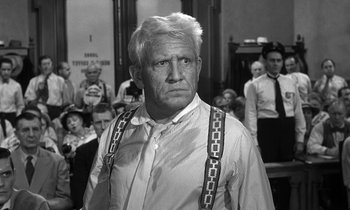 Movie still from “Inherit the Wind” (1960), directed by Stanley Kramer – An older man in a crowd of people; Medium shot, Low angle