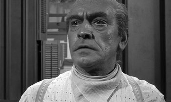 Movie still from “Inherit the Wind” (1960), directed by Stanley Kramer – An older man in a black and white photo; Close Up shot, Low angle